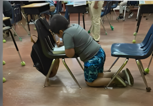 Mom Wants Answers After Seeing a Picture of Her Child Working without A Desk at Homestead School