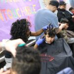 Local barbershop provides holiday cheer with free haircuts in Staten Island school