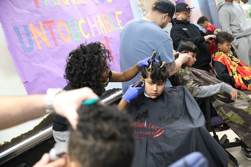 Local barbershop provides holiday cheer with free haircuts in Staten Island school