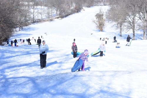 Photos: NYC snow lets children children enjoy sledding, while adults clean up from storm